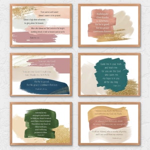 May include: Six framed art prints with inspirational quotes. Each print features a wooden frame, colorful brushstrokes in pink, gold, blue, and green, and elegant typography. The quotes are from Psalms.