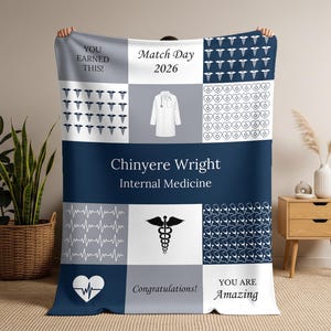 May include: A personalized navy blue and white blanket with text and medical symbols. The blanket features the name "Chinyere Wright" and "Internal Medicine." It includes the text "Match Day 2026," "You Earned This!" and "You Are Amazing."