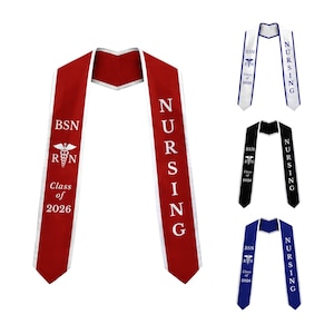 May include: A collection of four graduation stoles in red, white, black, and blue. Each stole features the text BSN, RN, Class of 2026, a caduceus symbol, and the word Nursing printed vertically in a contrasting color along the fabric panels.