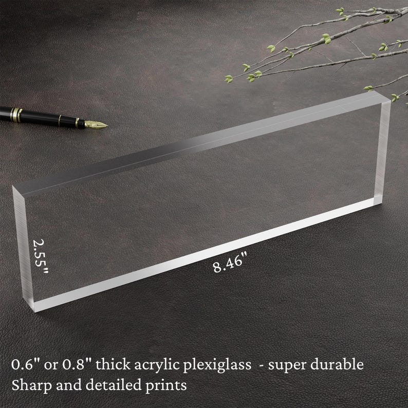 May include: A clear acrylic plaque measuring 21.5 cm by 6.5 cm. The plaque is 1.5 or 2 cm thick and made of durable plexiglass.  Sharp and detailed prints.
