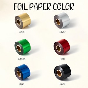 Puede incluir: Imagen de seis rollos de papel de aluminio en varios colores: dorado, plateado, verde, rojo, azul y negro. El texto "FOIL PAPER COLOR" est&aacute; en la parte superior de la imagen, con cada color etiquetado debajo de su rollo.