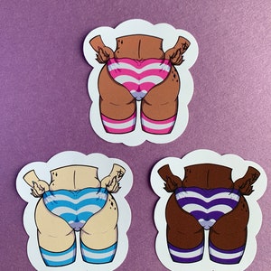 May include: Three sticker designs featuring a cartoon illustration of a person's lower body wearing striped underwear and thigh-high socks. The stickers are on a purple background. The underwear is pink and white striped, blue and white striped, and purple and white striped.