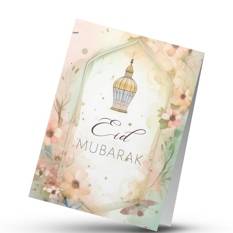 May include: A greeting card with a watercolor floral design featuring a gold lantern with a blue interior. The text "Eid Mubarak" is written in brown cursive lettering.