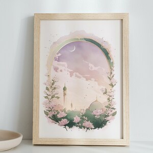 May include: A framed watercolor painting of a mosque with a crescent moon in the sky. The mosque is surrounded by pink flowers and greenery. The painting has a soft, dreamy feel.