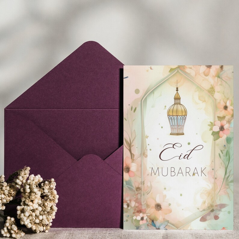 May include: A greeting card with a watercolor background featuring a floral design and a lantern. The card says "Eid Mubarak" in a decorative font.
