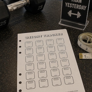 May include: A white paper weight tracker sheet with a grid of boxes labeled DATE and a line for entries. The sheet features the text WEIGHT TRACKER and www.sparrowhillfarms.com. A 60-inch measuring tape is visible next to the paper.