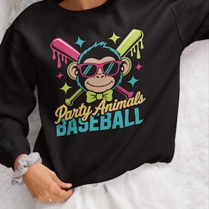 May include: Black sweatshirt with a colorful graphic featuring a monkey wearing sunglasses and a bow tie, crossed baseball bats, and the text "Party Animals BASEBALL". The design includes pink, green, and blue accents.