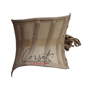 May include: A beige corset with a mesh panel and a lace-up back. The corset has a "Corset London" logo on the front.