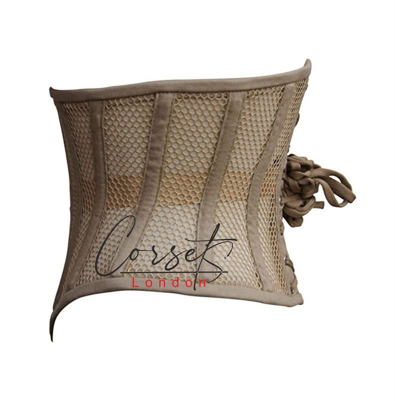 May include: A beige corset with a mesh panel and a lace-up back. The corset has a "Corset London" logo on the front.