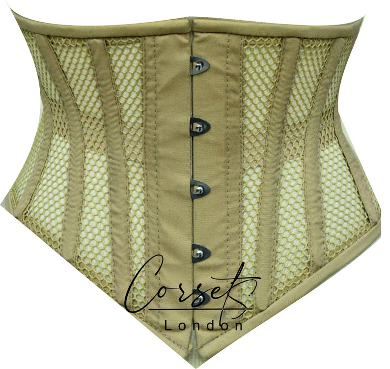 May include: A beige corset with a mesh panel design and black metal hooks. The corset has a pointed bottom and the text "Corset London" is printed on the front.