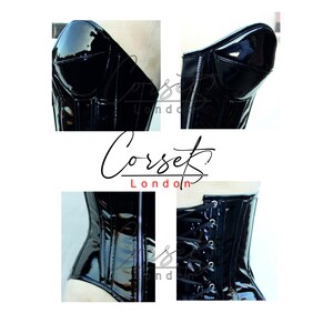 May include: Black patent leather corset with a zip up the front and a lace-up back. The corset has boning and a structured cup.