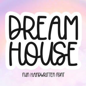 May include: A white sticker with black text that reads "DREAM HOUSE" in a fun handwritten font.