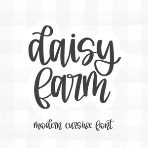 May include: A white sticker with the words "daisy farm" in a modern cursive font. The text is in dark gray, with the words "modern cursive font" in a smaller font below.