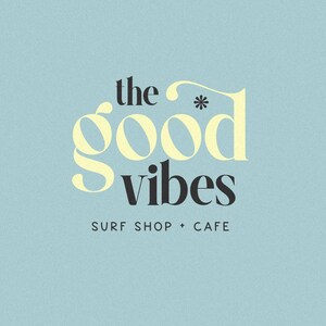 May include: The words "the good vibes" in a stylized font, with "good" in a light yellow color and "vibes" in black. Below, the text "surf shop + cafe" is in a smaller, dark font. The background is a light blue.