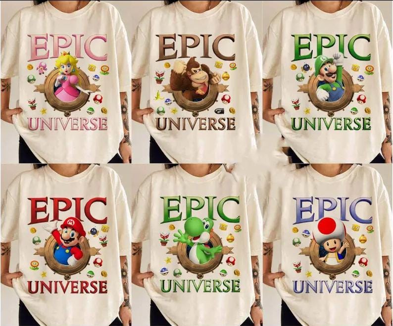 May include: Six white t-shirts with a colorful graphic print of a video game character and the text "EPIC UNIVERSE".