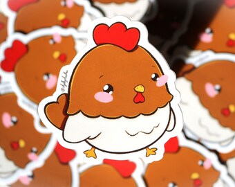 May include: A close-up of a sticker featuring a cartoon chicken with a red comb, brown feathers, and white underbelly. The chicken has large, round eyes and a cute expression.