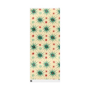 May include: A rectangular decorative item featuring a repeating pattern of green starbursts with red and light green accents on a cream background. The design is symmetrical and covers the entire surface.