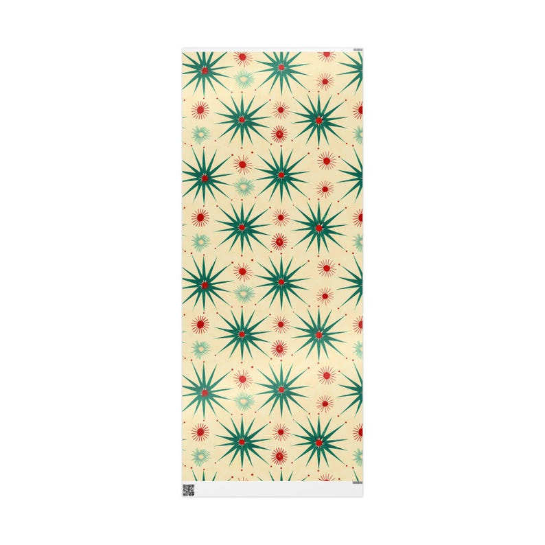 May include: A rectangular decorative item featuring a repeating pattern of green starbursts with red and light green accents on a cream background. The design is symmetrical and covers the entire surface.