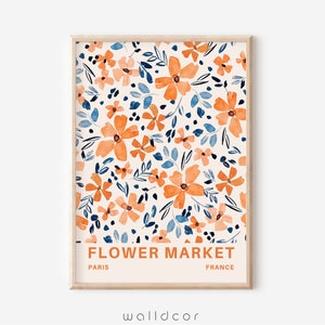 May include: A printable art print with a watercolor floral pattern in shades of orange, blue, and white. The print features the text "FLOWER MARKET" with "PARIS" and "FRANCE" below.