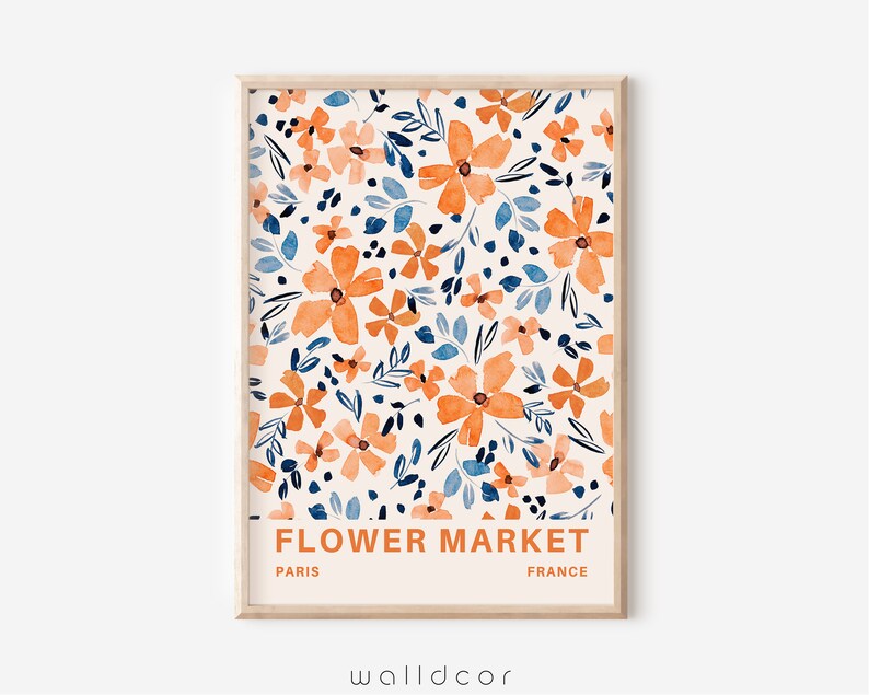May include: A printable art print with a watercolor floral pattern in shades of orange, blue, and white. The print features the text "FLOWER MARKET" with "PARIS" and "FRANCE" below.