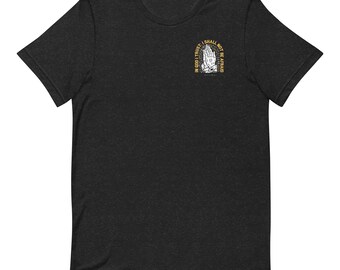 May include: A black t-shirt with a graphic of praying hands and the text "In God I Trust, I Shall Not Be Afraid".