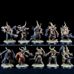 May include: A set of 10 painted miniature figures, depicting grotesque, mutated humanoids with horns, claws, and various weapons. The figures are posed in dynamic stances and feature detailed paintwork, including flesh tones, metallic accents, and blood splatters.
