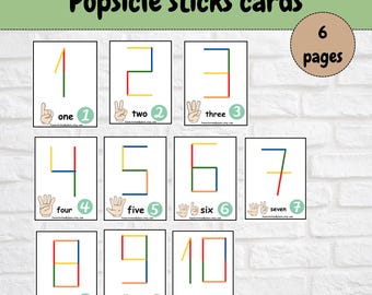 Pode incluir: Um conjunto de cartões educativos intitulados Popsicle sticks cards, com os números de um a dez formados por linhas coloridas. Cada cartão exibe o número correspondente em sinais de mão e dígitos. O conjunto inclui 6 páginas como download digital.