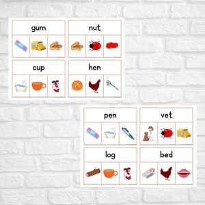 May include: A set of printable educational flashcards for young learners. Each card features a word and three images, one of which matches the word. The words include gum, nut, cup, hen, pen, vet, log, and bed.