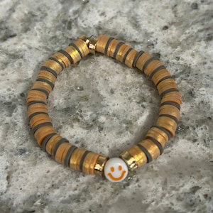 Gold and Grey Smiley face clay beaded bracelet