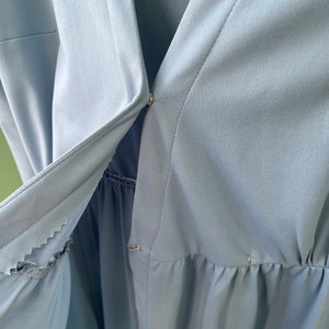 Awesome Comfortable Home stitch stretch polyester wrap dress in light blue Deep v neck approximately size 12