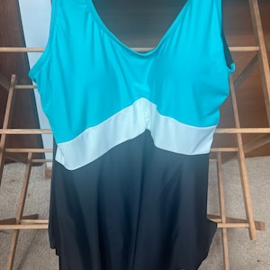 Size 20W skirt swimsuit swim dress by Blair catalog in black blue and white with a geometric pattern on the from of the suit . Lightly  worn