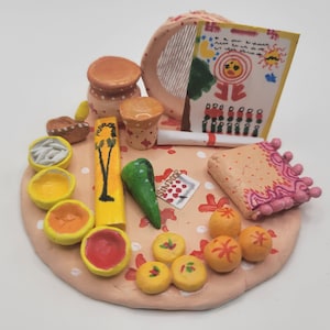 Clay miniature of Karwa Chauth pooja thali set; Return gift
