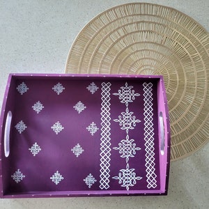 Kolam (Traditional decorative art) motif painting on a wooden tray