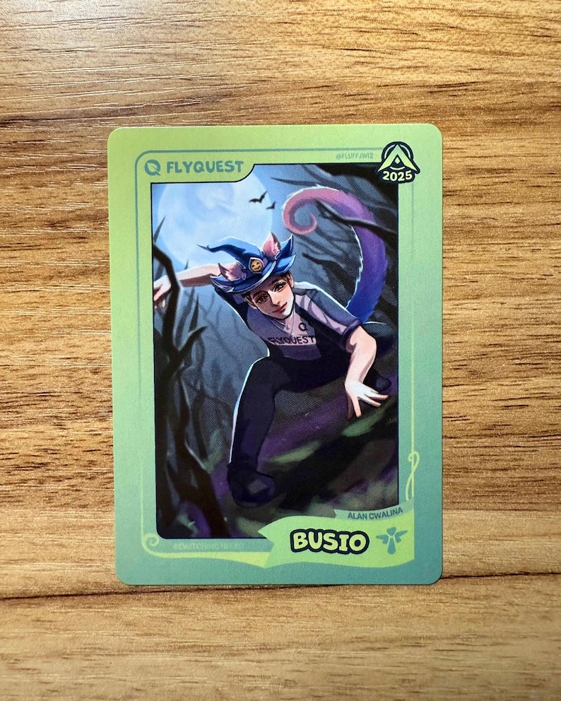A trading card featuring lolesports LCS and LEC professional player Alan Cwalina, aka Busio, in the FlyQuest 2025 pink jersey. He is drawn landing on the ground of a dark spooky forest as if he just ulted as Bewitching Neeko, one of his iconic League of Legends champions. The card has a green gradient border with the text "BUSIO" and the Support icon at the bottom right, 'BEWITCHING NEEKO' at the bottom left, the LTA North logo and 2025 at top right, and the FLYQUEST name and logo at top left.