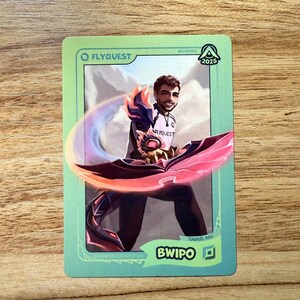 A trading card featuring lolesports LCS and LEC professional player Gabriël Rau, aka Bwipo, in the FlyQuest 2025 pink jersey. He is drawn in an attacking pose as Dawnbringer Renekton with the obsidian chroma, a signature League of Legends champion of his. The card has a green gradient border with the text "BWIPO" and the top lane icon at the bottom right, 'DAWNBRINGER RENEKTON' at the bottom left, the LTA North logo and 2025 in the top right, and the FLYQUEST name and logo at the top left.