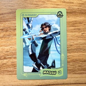A trading card featuring lolesports LCS professional player Fahad Abdulmalek, aka Massu, in the FlyQuest 2025 green jersey. He is drawn aiming a bow as Arctic Ops Varus, one of his iconic League of Legends champions, in a bright arctic setting. The card has a green gradient border with the text "MASSU" and the Bot Lane ADC icon at the bottom right, 'ARCTIC OPS VARUS' at the bottom left, the LTA North logo and 2025 in the top right, and the FLYQUEST name and logo at the top left.