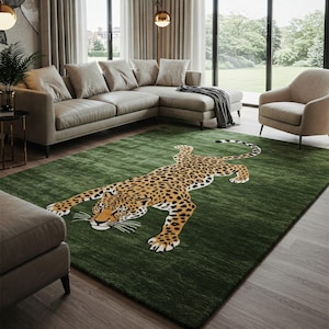 May include: A green rug featuring a large, detailed illustration of a leopard lying down. The rug is in a living room setting with a sofa and an armchair.