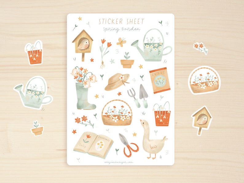 May include: A sticker sheet with a spring garden theme. The sheet features watercolour illustrations of a birdhouse, watering can, flowers, gardening tools, a goose, and the text "Sticker Sheet spring garden".