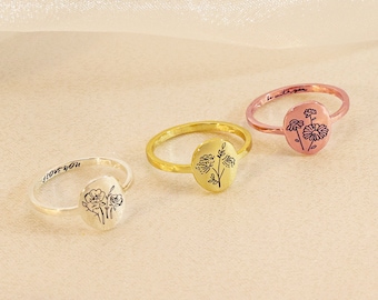 May include: Three silver, gold, and rose gold rings with an oval floral design. The rings have the words "Love You", "Be With You", and "Forever" engraved on them.