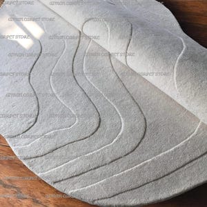 Irregular Off White Woolen Rug: Handmade Area Rug