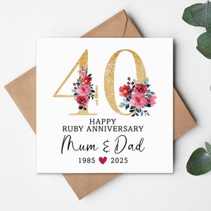 May include: A white anniversary card with a gold glitter "40" and floral accents. The card reads "Happy Ruby Anniversary Mum & Dad 1985-2025". Includes a brown envelope. The card is personalised.