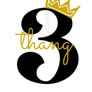 May include: Black number three with a gold crown on top. The number is stylized with a cursive "thang" written underneath.