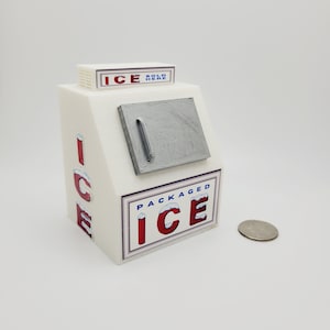May include: A white miniature ice house with a silver door and red and blue lettering that reads "ICE SOLD HERE" and "PACKAGED ICE".