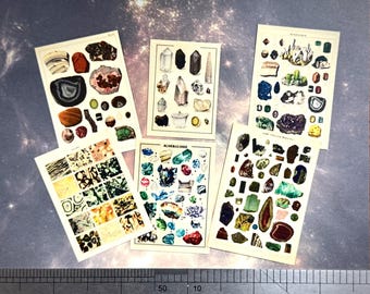 May include: Five vintage mineralogy prints featuring various gemstones and crystals. The prints showcase a variety of colors, including brown, green, blue, and red. The prints are arranged on a surface with a ruler at the bottom.