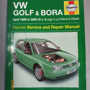 May include: A green Volkswagen Golf & Bora Haynes Service and Repair Manual for vehicles manufactured from April 1998 to 2000. The manual includes roadside repairs and MOT test checks.