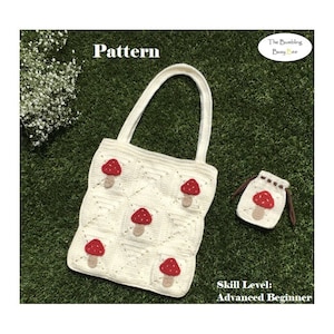 May include: A cream-colored crochet tote bag and small pouch, both adorned with red mushroom appliqu&eacute;s. The tote bag features a square pattern and a handle. The text "Pattern" is visible. The skill level is "Advanced Beginner".