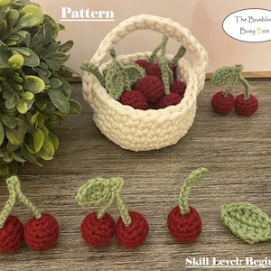 May include: Crochet pattern for a basket of cherries. The pattern includes instructions for making a small basket and multiple cherries. The skill level is beginner. The image shows a completed basket of cherries and several individual cherries.