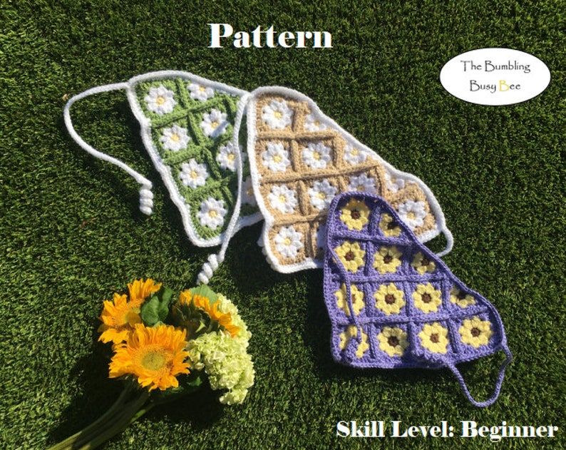May include: Three crocheted triangle tops with daisy and sunflower designs. The tops are green, beige, and purple. The text "The Bumbling Busy Bee" and "Skill Level: Beginner" are visible in the image.