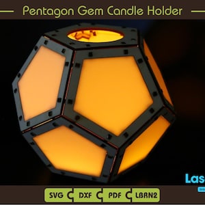May include: A geometric pentagon-shaped candle holder with a warm, glowing interior. The holder is constructed with a dark frame and light orange panels. The text "Pentagon Gem Candle Holder" is at the top.