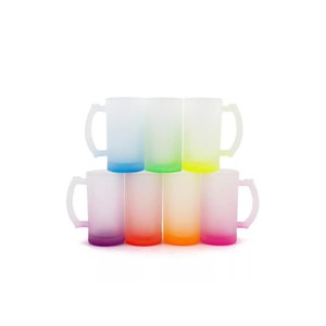 May include: Set of seven frosted glass mugs with colour-changing bottoms. The mugs are arranged in a pyramid shape with the colours ranging from purple to red, orange, yellow, green, blue, and light blue.